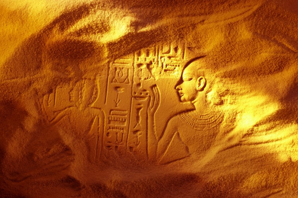 An image of an ancient Egyptian structure buried beneath the sand. Shutterstock.