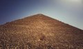 A view of the Great Pyramid of Giza, its entrance and people accessing it. Shutterstock.