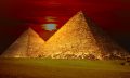 An image of the Egyptian pyramids and the sunset in the background. Shutterstock.