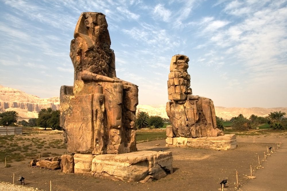 A photograph of The Colossi of Memnon, near Luxor, Egypt. Shutterstock.