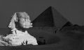The Great Sphinx with the Pyramid of Pharaoh Cheops in the background. 1877 photo by French photographer Henri Bechard. Shutterstock.