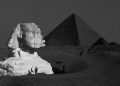 The Great Sphinx with the Pyramid of Pharaoh Cheops in the background. 1877 photo by French photographer Henri Bechard. Shutterstock.