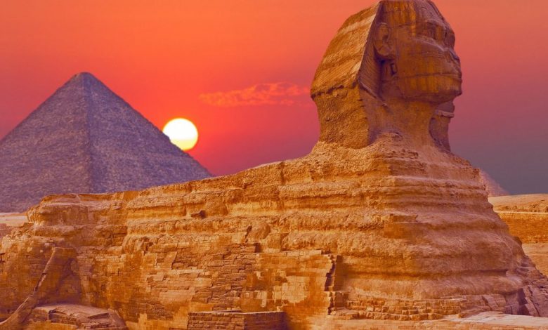 An image of the Great Sphinx of Giza with the Great Pyramid in the background. Shutterstock.