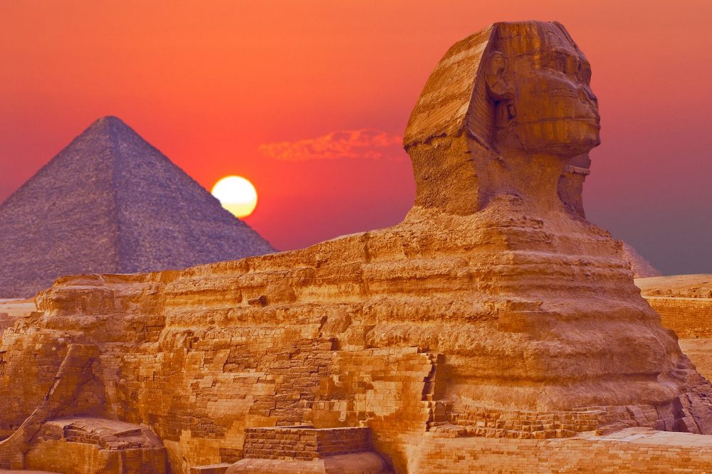 An image of the Great Sphinx of Giza with the Great Pyramid in the background. Shutterstock.