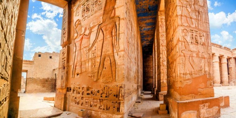 An image of the Temple of Medinet Habu. Egypt, Luxor. Shutterstock.