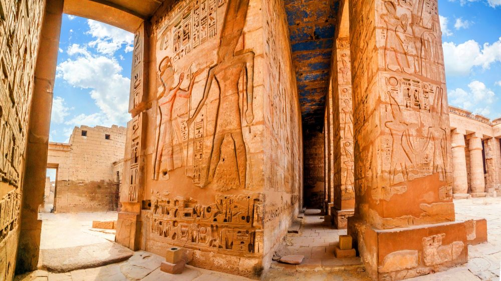 An image of the Temple of Medinet Habu. Egypt, Luxor. Shutterstock.