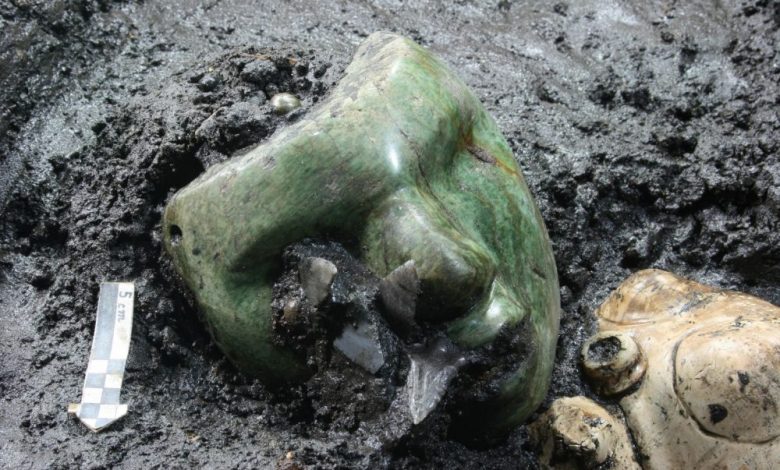 An image of the green serpentine mask discovered at the base of the Pyramid of the Sun in Teotihuacan. Image Credit: INAH.