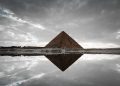 An image of an ancient Egyptian pyramid and its reflection. Shutterstock.