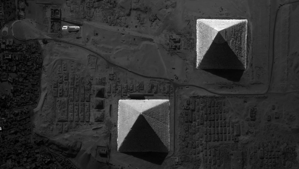 A birdlike image of the Pyramids at Giza and the Great Sphinx.