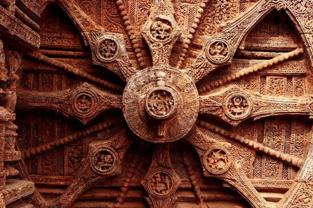 An image of the intricate carvings on the stone wheel of the Konark Sun Temple. Shutterstock.
