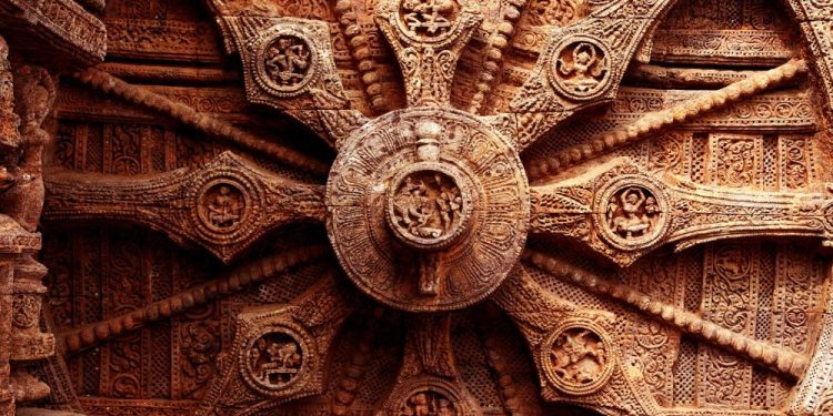 An image of the intricate carvings on the stone wheel of the Konark Sun Temple. Shutterstock.