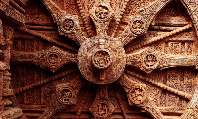 An image of the intricate carvings on the stone wheel of the Konark Sun Temple. Shutterstock.
