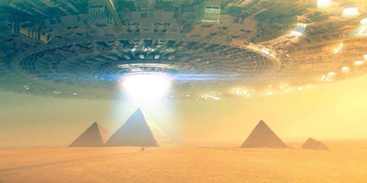 An artists rendering of a massive spaceships hovering above the ancient Egyptian pyramids at Giza. Shutterstock.