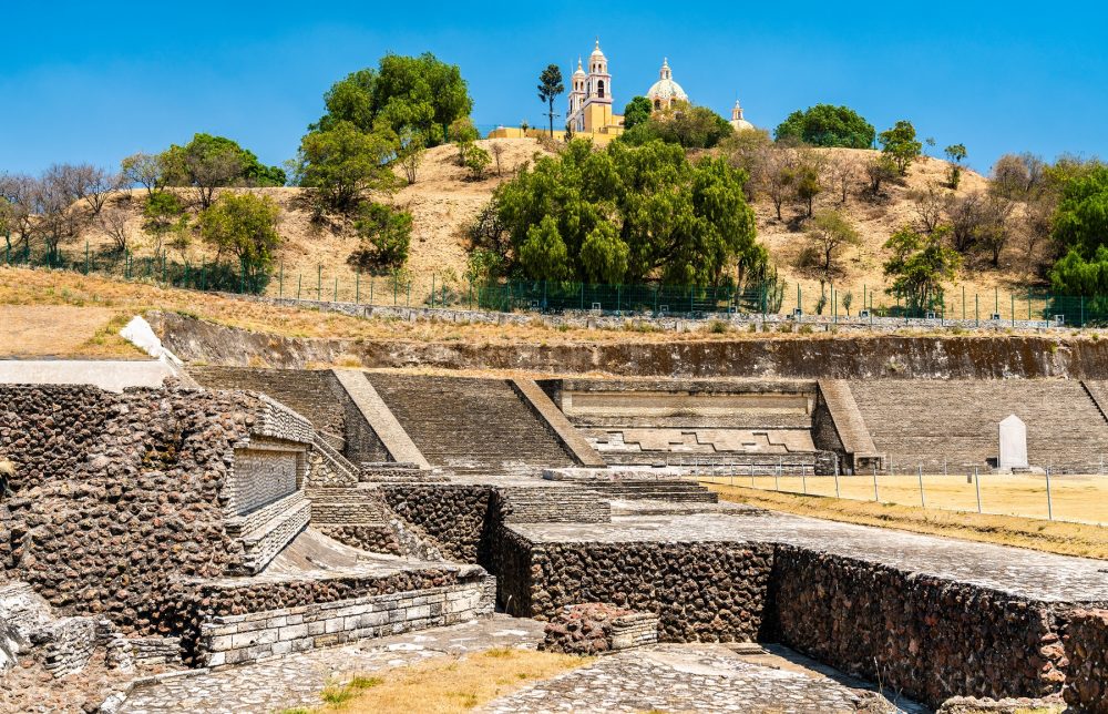 An image of the ruins of the Great Pyramid of Cholula with the Church of Our Lady of Remedies built on top of the pyramid. Shutterstock.