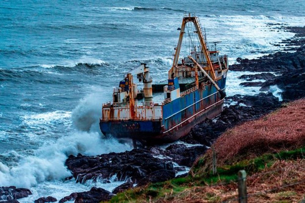An image of the 77-meter-long cargo vessel the MV Alta, snagged on the rocks of the Irish Coast. Irish Times / Irish Coast Guard.