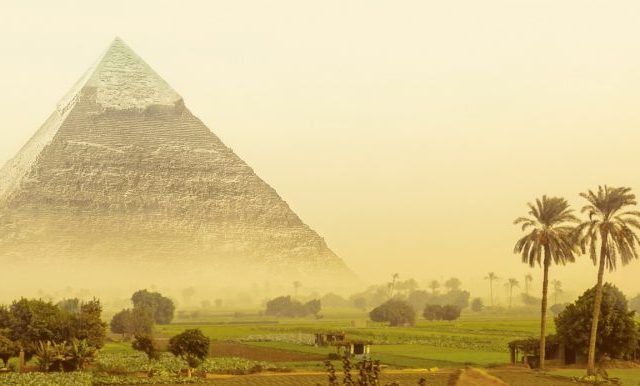 An artists illustration of the pyramid of Khafre and a fantasy landscape. Shutterstock.