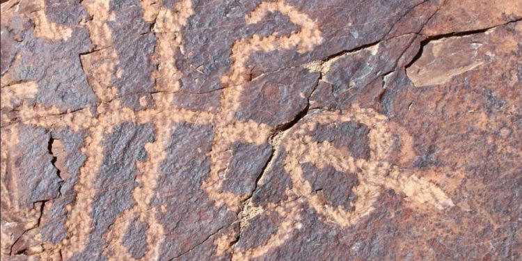 An image of the ancient rock art carving showing a creature interpreted by experts as being half man half mantis. Image Credit: Mohammad Naserifard.