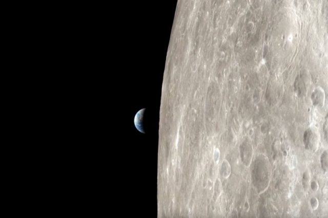 Apollo 13 view of the surface of the moon and Earth. Image Credit: NASA.