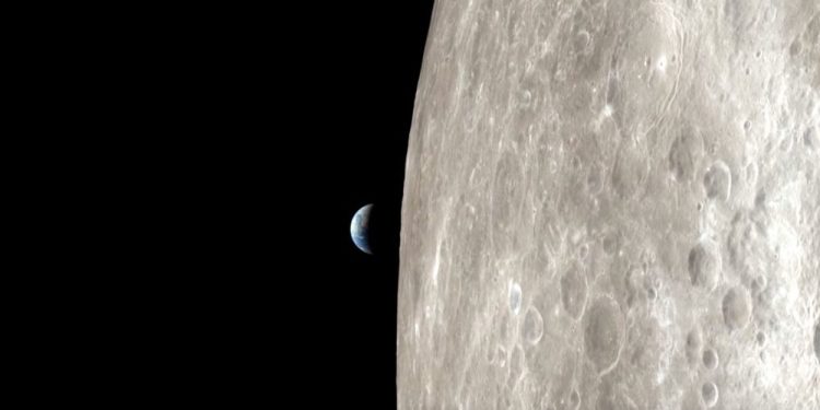 Apollo 13 view of the surface of the moon and Earth. Image Credit: NASA.