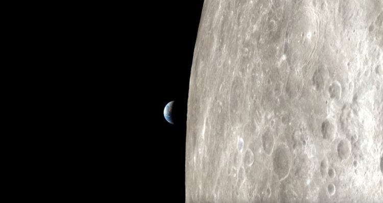 Apollo 13 view of the surface of the moon and Earth. Image Credit: NASA.