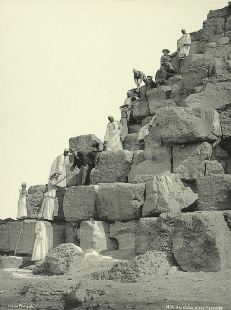 An image of a group of people climbing the pyramid. Photograph taken around 1870.