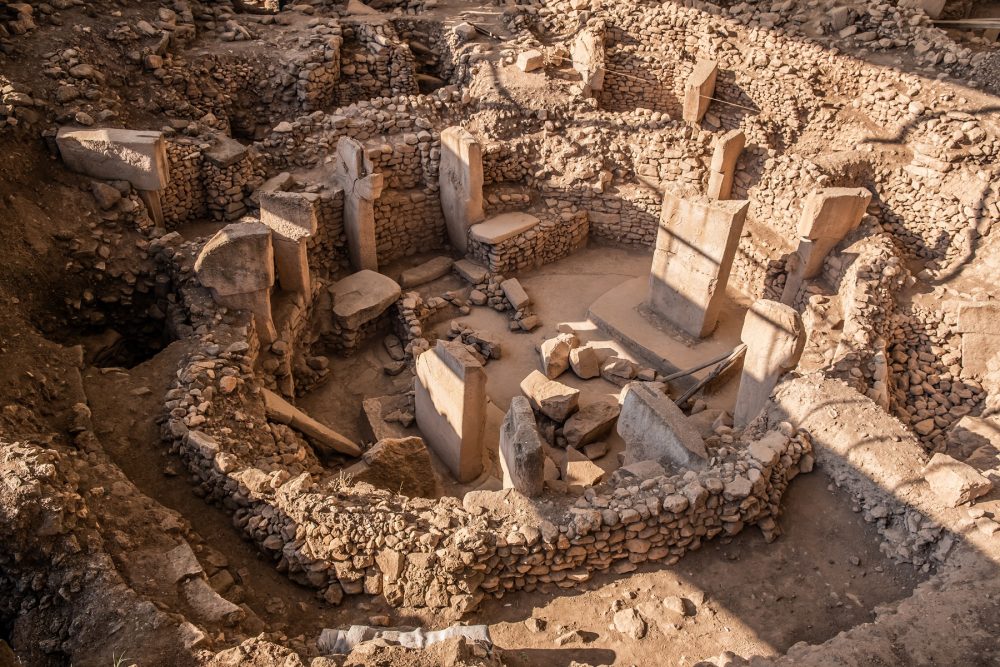 An image showing one of the megalithic circles at Gobekli Tepe and its famous stone pillars. Shutterstock.