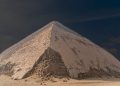 An image of the Bent Pyramid at Dahshur, and people circled in red standing next to the pyramid. Shutterstock