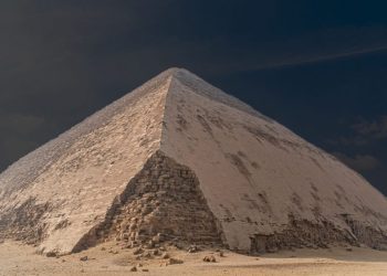 An image of the Bent Pyramid at Dahshur, and people circled in red standing next to the pyramid. Shutterstock