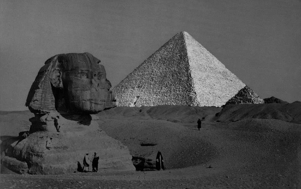 The Great Sphinx with the Pyramid of Pharaoh Cheops in the background. 1877 photo by French photographer Henri Bechard. Shutterstock.