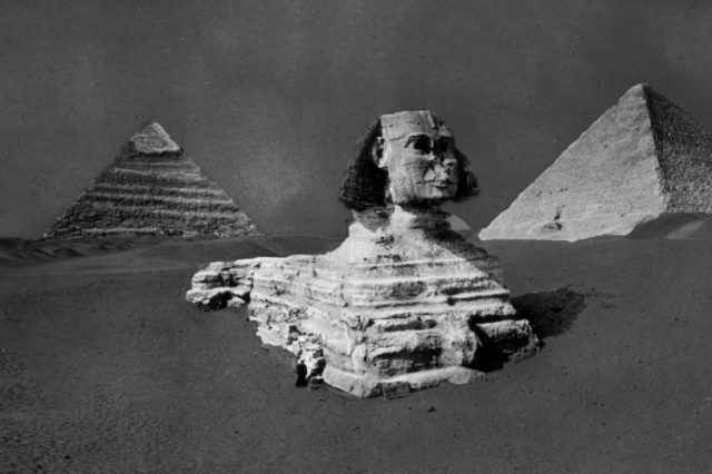 A rare image of the Great Sphinx, Khufu and Khafre's Pyramid before the Sphinx was fully excavated. Image Credit: Brooklyn Museum.