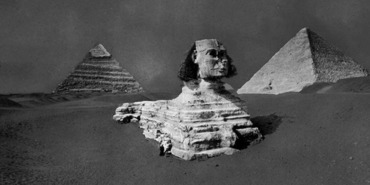 A rare image of the Great Sphinx, Khufu and Khafre's Pyramid before the Sphinx was fully excavated. Image Credit: Brooklyn Museum.