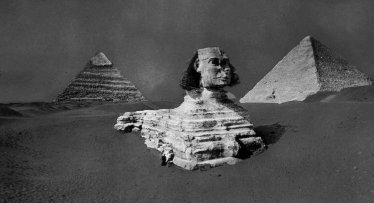 A rare image of the Great Sphinx, Khufu and Khafre's Pyramid before the Sphinx was fully excavated. Image Credit: Brooklyn Museum.