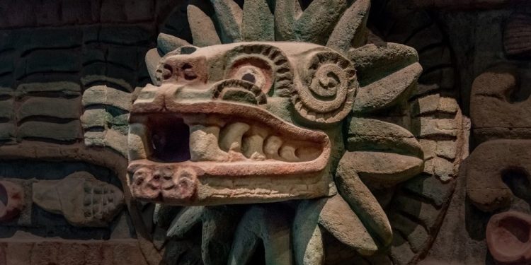 An ancient statue depicting the feathered serpent Quetzalcoatl. Shutterstock.