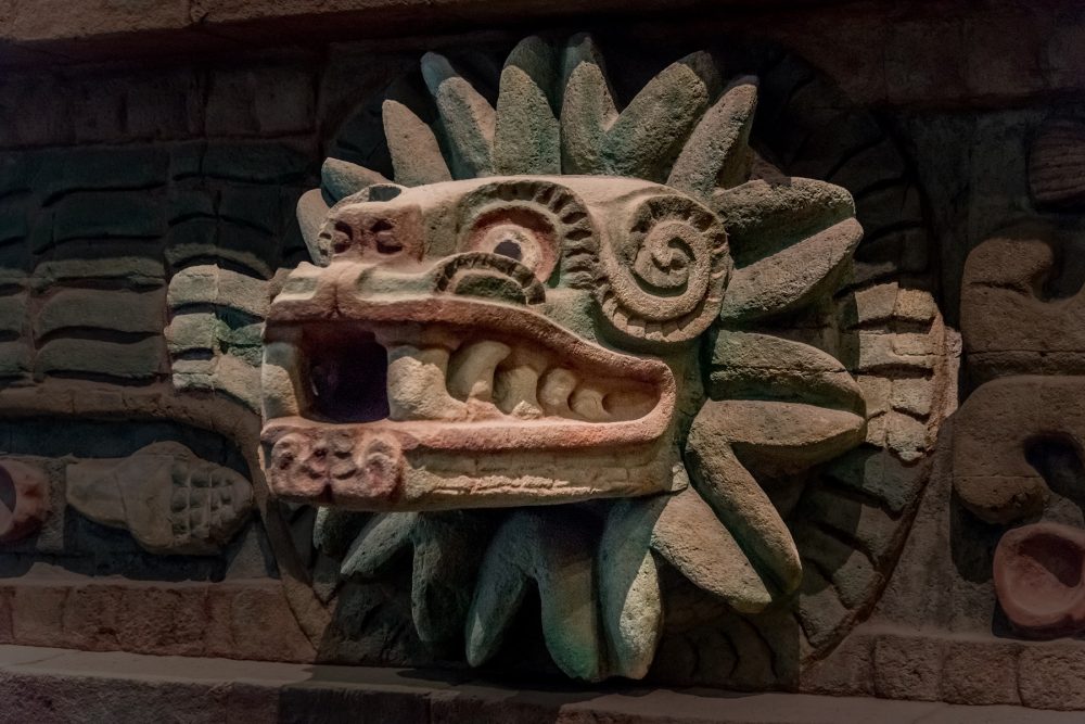 An ancient statue depicting the feathered serpent Quetzalcoatl. Shutterstock.