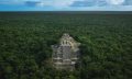An aerial image of the Pyramid of Calakmul rising above the dense rain-forest beneath. Shutterstock.