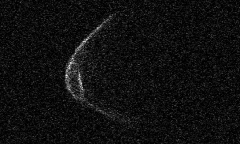 An image of asteroid 1998 OR2 which makes it look as if the asteroid was wearing a mask. Image Credit: Arecibo Observatory.