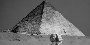 A rare image of the Great Pyramid of Giza and the Sphinx still buried beneath the surface. Shutterstock.