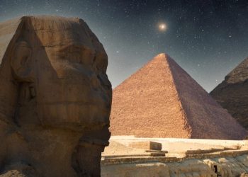 An image of the Sphinx, the Pyramid of Khafre, and the Great Pyramid of Giza in the middle. Shutterstock.