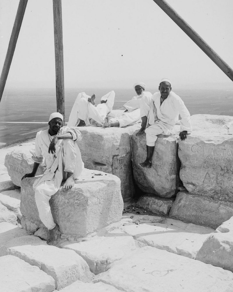 An image of people resting at the summit of the Great Pyramid of Giza. The image was taken circa 1900. Image Credit: Library of Congress.