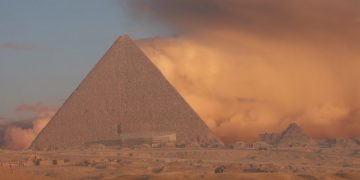 An image of the Great Pyramid of Giza with a sand storm in the background. Shutterstock.