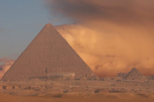 An image of the Great Pyramid of Giza with a sand storm in the background. Shutterstock.