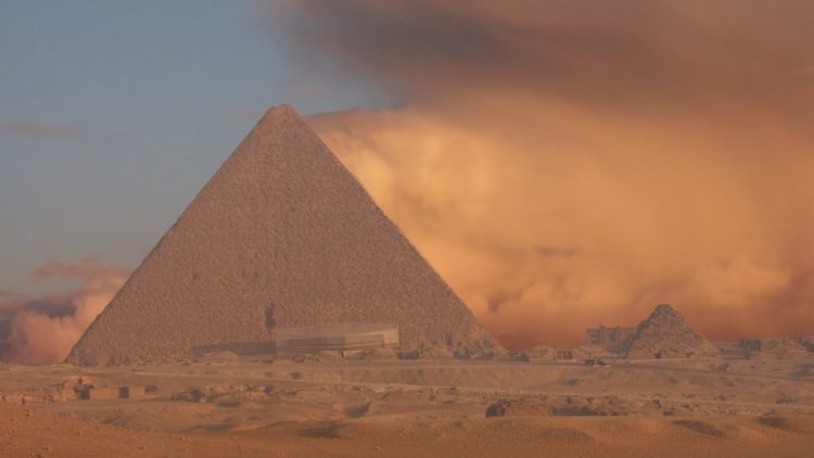 An image of the Great Pyramid of Giza with a sand storm in the background. Shutterstock.