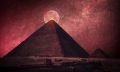 The Great Pyramid of Giza in front of a Full Moon. Shutterstock.