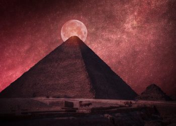 The Great Pyramid of Giza in front of a Full Moon. Shutterstock.