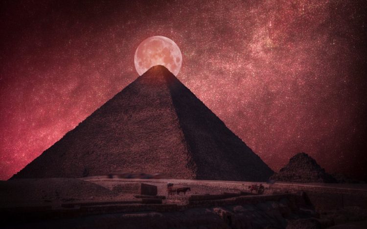 The Great Pyramid of Giza in front of a Full Moon. Shutterstock.