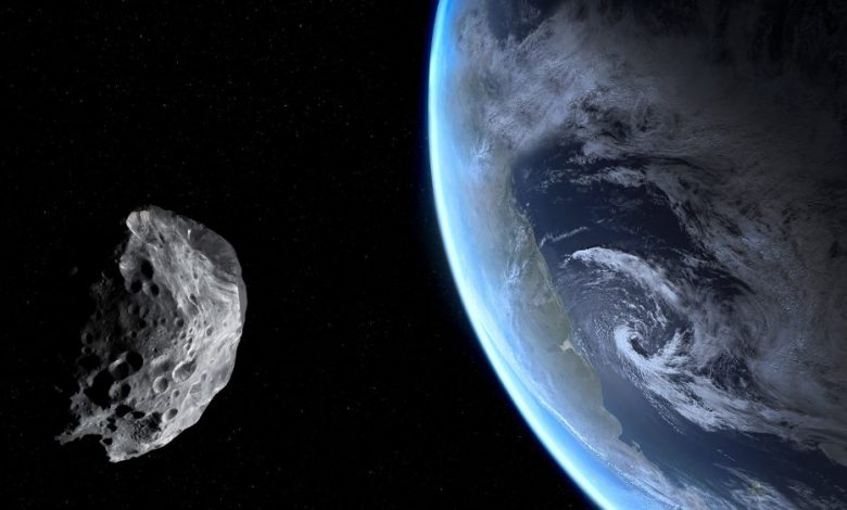 An asteroid in space and Earth. Shutterstock.