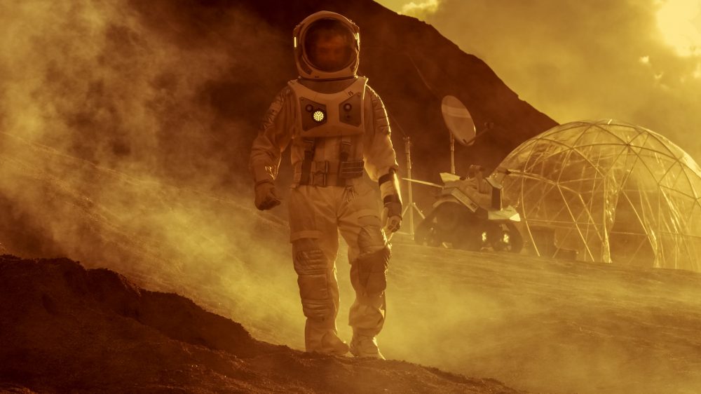 An artist's illustration of an astronaut walking on the surface of Mars. Shutterstock.