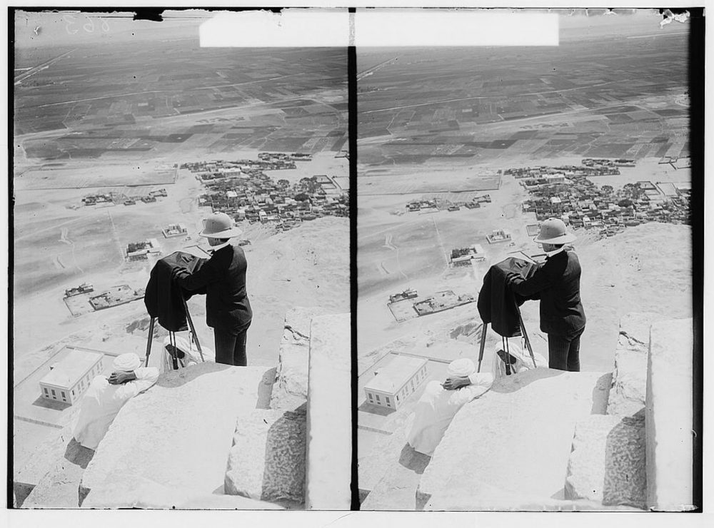 An image that shows American Colony Photo Department photographer Lewis Larsson with camera, looking down from near the top of the Great Pyramid. Image Credit: American Colony (Jerusalem). Photo Department / Library of Congress.