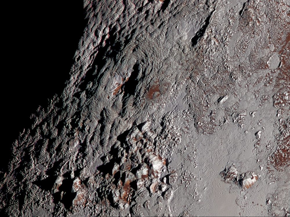 An image of Pluto’s Wright Mons in color. It shows of one of two potential cryovolcanoes spotted on the surface of Pluto by the New Horizons spacecraft in July 2015. Image Credit: New Horizons.