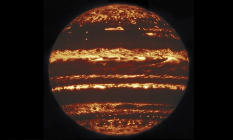 This image shows the entire dis of Jupiter in infrared. It was compiled from nine separate pointing by the International Gemini Observatory. Image Credit: (International Gemini Observatory/NOIRLab/NSF/AURA M.H. Wong & team/Mahdi Zamani).